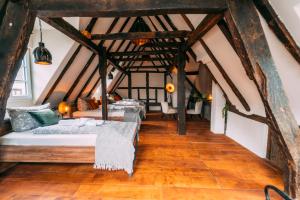 a room with four beds in a attic at Haus zum Ring in Adenau