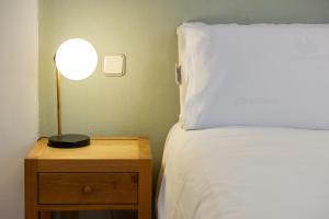 Łóżko lub łóżka w pokoju w obiekcie Oriente Suites