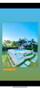 una imagen de una casa con piscina en Club Monet Beachfront Resort by Cocotel, en Zambales
