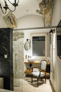a bathroom with a sink and a shower at Hotel Pok Garni in Brezovica