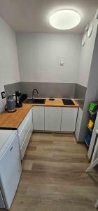 a kitchen with a sink and a counter top at Route66 apartament by Karl in Radom