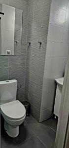 a bathroom with a toilet and a sink at Route66 apartament by Karl Clim&Park in Radom +7 photos