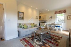 a living room with a couch and a table at The Applery, Leyburn Yorkshire Dales National Park in Leyburn