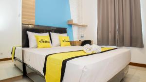 Letto o letti in una camera di My Rooms at Paskal Hyper Square