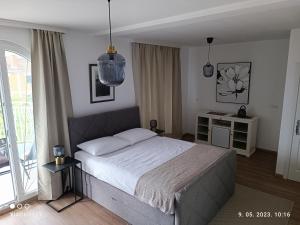 Postel nebo postele na pokoji v ubytování Marko Rooms