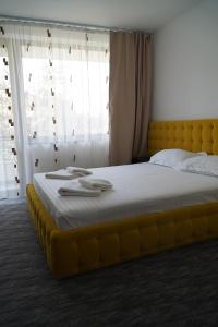 Ένα ή περισσότερα κρεβάτια σε δωμάτιο στο Hotel & MedSpa Siret