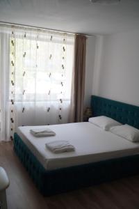 Ένα ή περισσότερα κρεβάτια σε δωμάτιο στο Hotel & MedSpa Siret