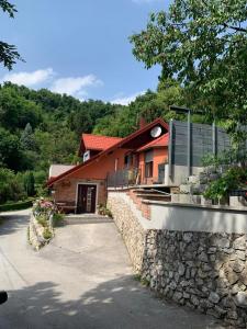a house with a stone wall next to a building at Holiday house with a parking space Krapina, Zagorje - 21000 in Krapina