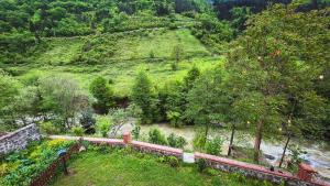 an aerial view of a garden with trees and a hill at Heaven Forest Villa in Macka