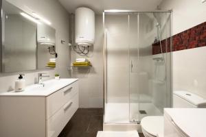 a bathroom with a shower and a sink and a toilet at Stay Barcelona Sant Antoni in Barcelona