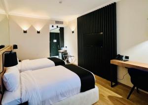 Katil atau katil-katil dalam bilik di Genesis Kosher Hotel Tbilisi