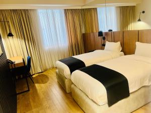 Katil atau katil-katil dalam bilik di Genesis Kosher Hotel Tbilisi
