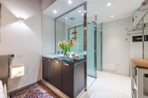 a bathroom with a sink and a mirror at Suite Martini al Castello in Cagliari