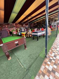 a store with a pool table in front of it at Villa privative tortues2 piscine individual 35min in Marrakesh