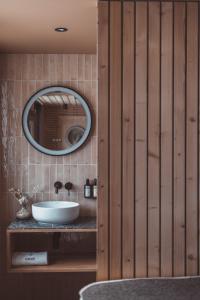 a bathroom with a sink and a mirror at La Voie Lactée in La Mongie +44 photos