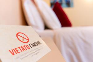 a sign that says welcome to a hotel room at Hotel Autoespresso Venice - Atika & Atif in Marghera