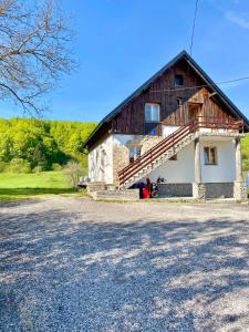 a large house with a large driveway in front of it at Guest House Plitvice Waterfall in Plitvička Jezera