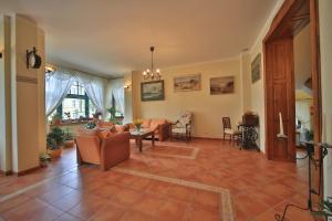 a living room with a couch and a table at Villa Alexandra in Świnoujście