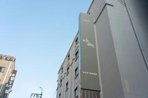 a building with a sign on the side of it at The Hyoosik Aank Hotel Bupyeong in Incheon