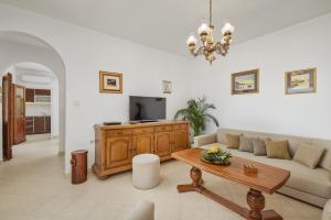 a living room with a couch and a table at Villa Ava in Kotor