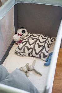 A bed or beds in a room at Outdooredo Garda Apartment