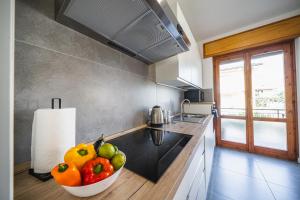A kitchen or kitchenette at Outdooredo Garda Apartment