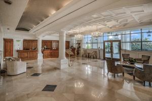 a large living room with a dining room and a kitchen at Seashells and Sunshine Marco Beach Ocean Resort 1105 in Marco Island +45 photos