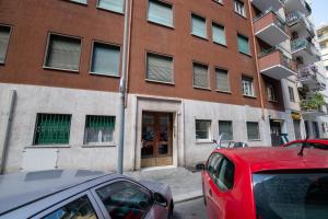 a red car parked in front of a building at Casa Labertino in Rome