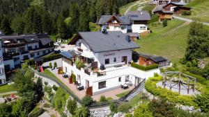 an aerial view of a large white house at Chalet Alpenblick in Fiss