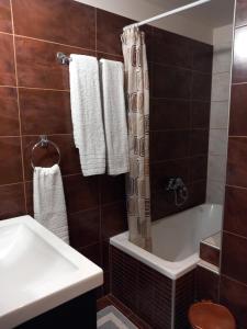 a bathroom with a tub and a toilet and a sink at Casa Loutsiano in Syvota +45 photos