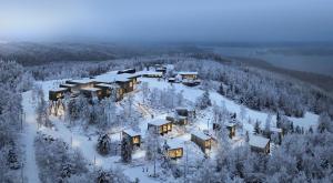 尼尔西艾Panorama Landscape Hotel的雪中房屋的空中景观
