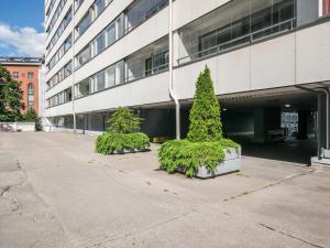 two trees in front of a building at Holiday Home Helsinki rooftop by Interhome in Helsinki