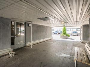 an empty parking lot with a bench in a building at Holiday Home Helsinki rooftop by Interhome in Helsinki