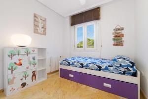 Łóżko lub łóżka w pokoju w obiekcie Casa Adelfas, Aguamarina