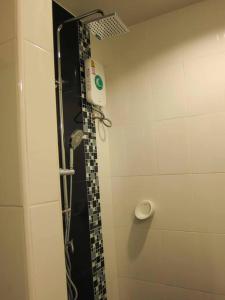 a bathroom with a shower with a black and white tile at Heaven 7 Panorama Seaview condo at Krabi in Krabi town