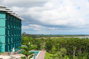 a view of a resort with a pool and trees at Heaven 7 Panorama Seaview condo at Krabi in Krabi town