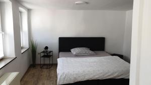 Postel nebo postele na pokoji v ubytování Ferienhaus Im Gäßchen + 2 fotografie