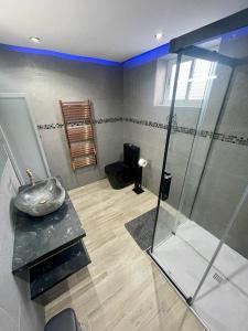 a bathroom with a sink and a glass shower at VILLA VAQUERO - Gandía in Gandía