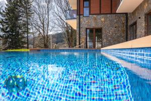 Bazén v ubytovaní Green Park Resort D5- z dostępem do basenu, sauny, jacuzzi, siłowni alebo v jeho blízkosti