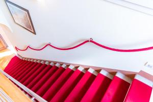 a red and white radiator in a room at Hotel Autoespresso Venice - Atika & Atif in Marghera