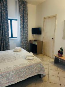 Letto o letti in una camera di Hotel Piccolo Paradiso Del Gargano