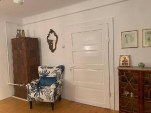 a room with a chair and a door at Casa Veronica in Sibiu