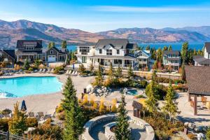 an aerial view of a resort with a pool and mountains at Chinook & Carriage House #2 in Chelan