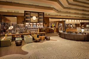 a lobby of a hotel with couches and a bar at Hyatt Regency San Francisco in San Francisco