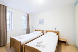 Postel nebo postele na pokoji v ubytování Hotel Rooms Roccia