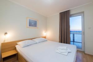 Postel nebo postele na pokoji v ubytování Hotel Rooms Roccia