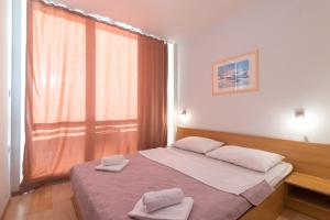 Postel nebo postele na pokoji v ubytování Hotel Rooms Roccia