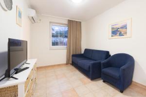TV a/nebo společenská místnost v ubytování Hotel Rooms Roccia