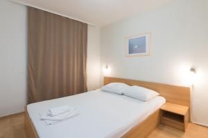 Postel nebo postele na pokoji v ubytování Hotel Rooms Roccia