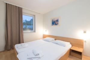 Postel nebo postele na pokoji v ubytování Hotel Rooms Roccia